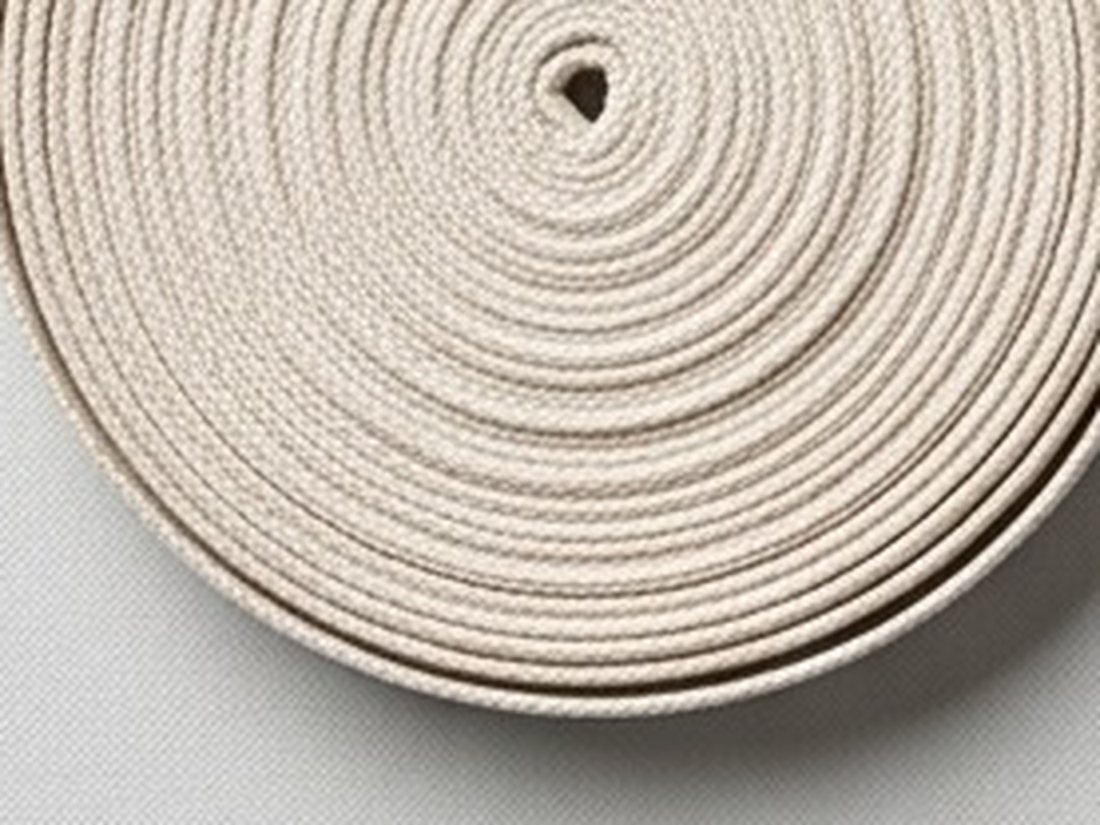 A flat coil of tape seen from above