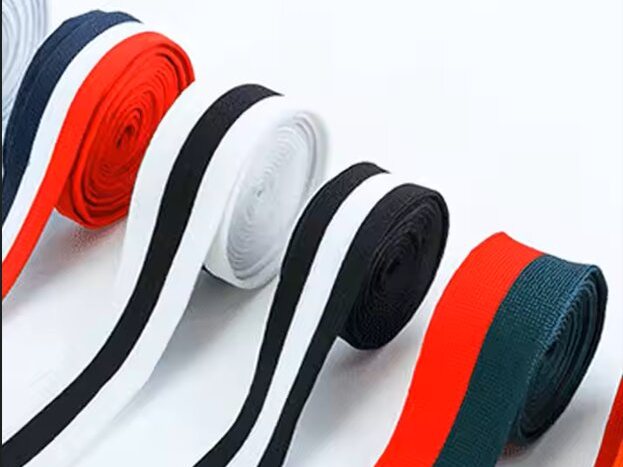 Striped polyester webbing rolled and stacked