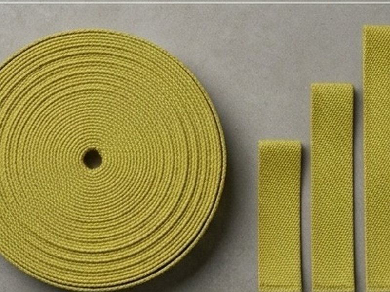 A roll of tape beside cut pieces in three different widths